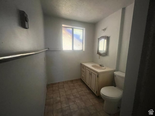 160 E 300 S, Gunnison, UT 84634 - bathroom featuring vanity and a textured ceiling