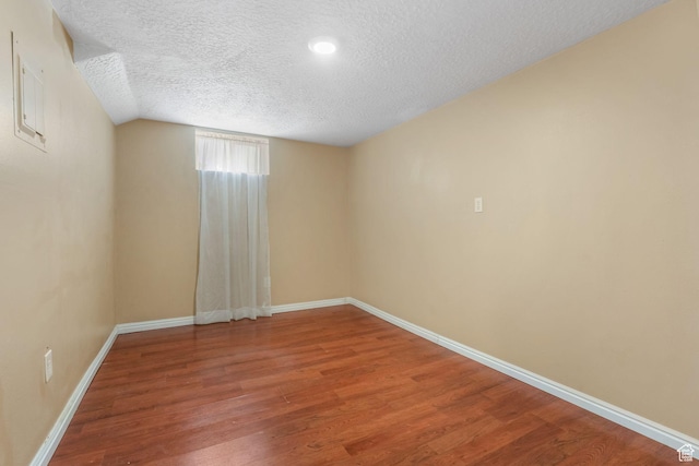 3909 S Rosemary St, West Valley City, UT 84120 - empty room featuring a textured ceiling, wood finished floors, and baseboards