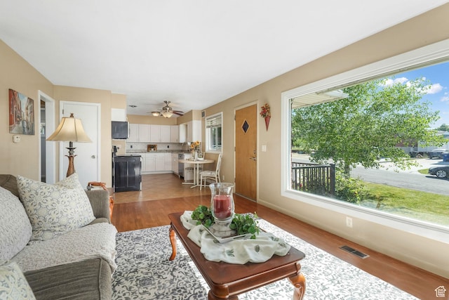 3909 S Rosemary St, West Valley City, UT 84120 - living room featuring wood finished floors and ceiling fan