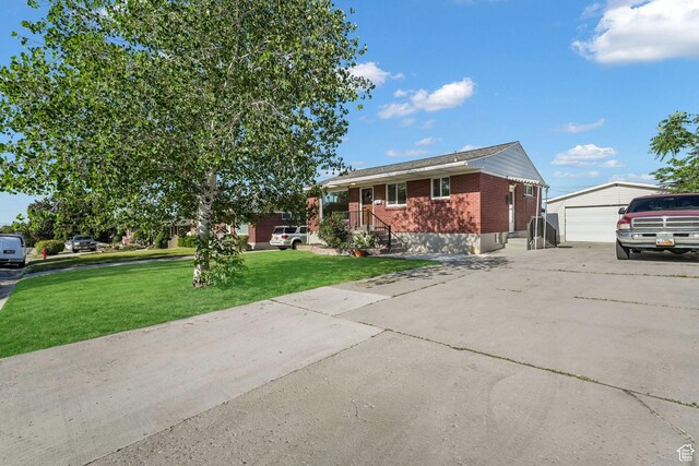 3909 S Rosemary St, West Valley City, UT 84120 - ranch-style home with an outdoor structure, a garage, brick siding, and a front yard