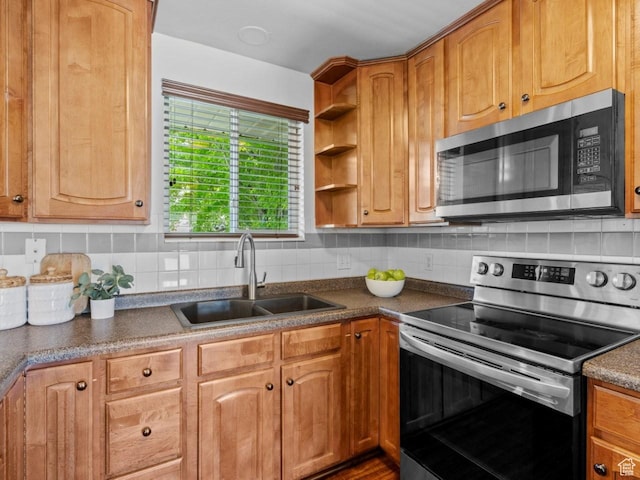 9750 S David St E, Sandy, UT 84070 - kitchen with appliances with stainless steel finishes, a sink, decorative backsplash, dark countertops, and open shelves