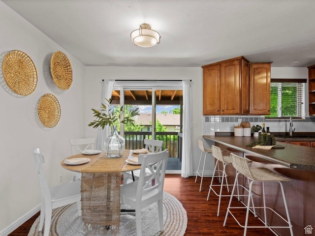 9750 S David St E, Sandy, UT 84070 - dining room featuring dark wood-style floors and baseboards