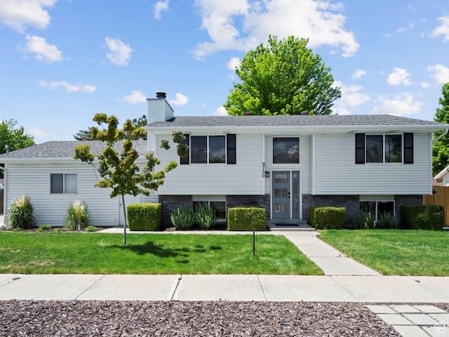 9750 S David St E, Sandy, UT 84070 - bi-level home featuring a chimney and a front yard