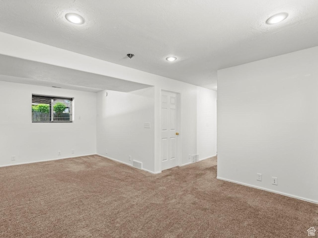 9750 S David St E, Sandy, UT 84070 - empty room featuring light carpet, recessed lighting, and baseboards