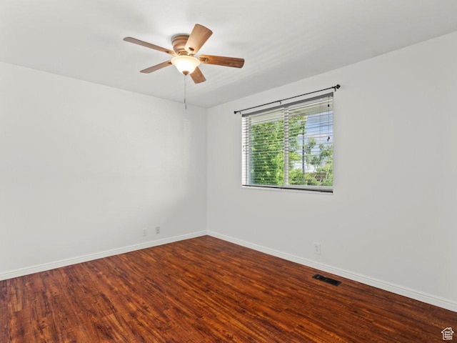 9750 S David St E, Sandy, UT 84070 - empty room with wood finished floors, baseboards, and ceiling fan