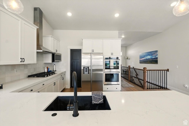 1335 S 1140 E, Heber City, UT 84032 - kitchen with stainless steel appliances, wall chimney exhaust hood, tasteful backsplash, wood finished floors, and white cabinets