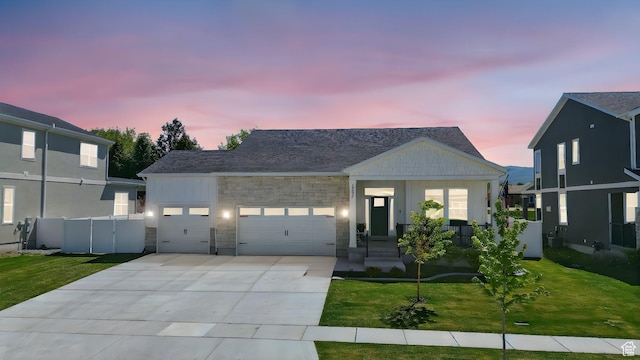 1335 S 1140 E, Heber City, UT 84032 - view of front of house featuring a garage, concrete driveway, and stone siding
