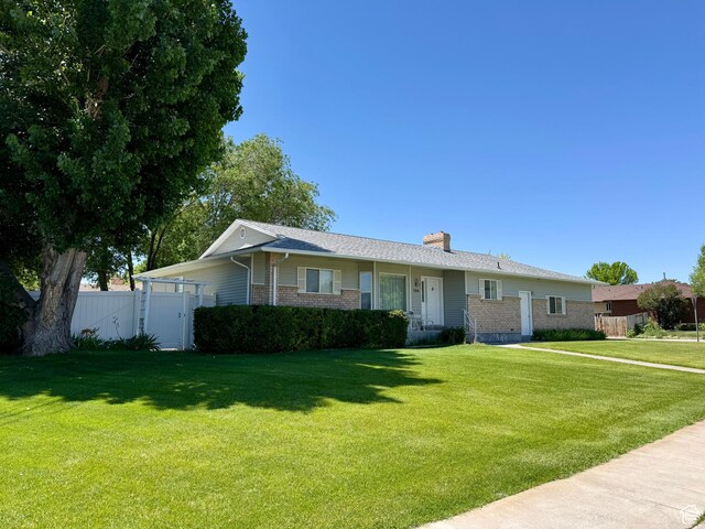 786 E Bristlecone Dr, Delta, UT 84624 - ranch-style home with brick siding and a chimney