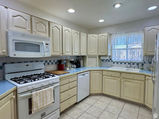 786 E Bristlecone Dr, Delta, UT 84624 - kitchen with white appliances, decorative backsplash, light tile patterned floors, light countertops, and recessed lighting