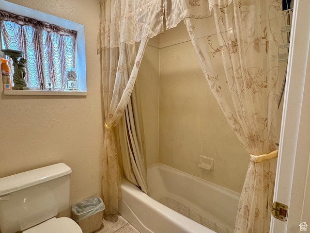 786 E Bristlecone Dr, Delta, UT 84624 - full bath featuring toilet, shower / bath combo with shower curtain, and tile patterned flooring