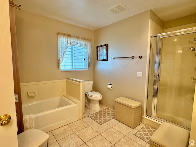786 E Bristlecone Dr, Delta, UT 84624 - bathroom with tile patterned floors, toilet, a bath, and a shower stall