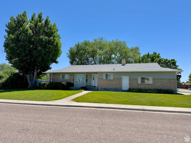 786 E Bristlecone Dr, Delta, UT 84624 - single story home featuring brick siding, a front lawn, and a chimney