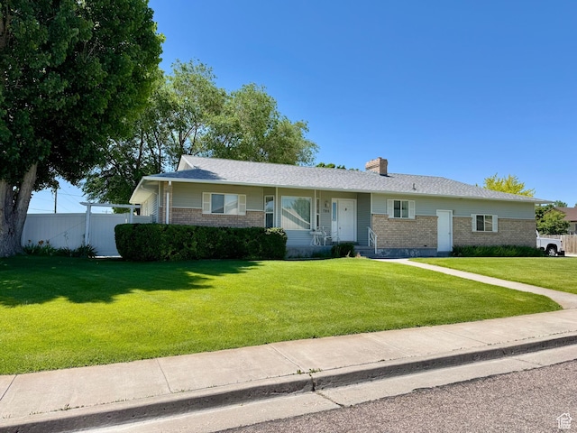 786 E Bristlecone Dr, Delta, UT 84624 - ranch-style home with brick siding and a chimney