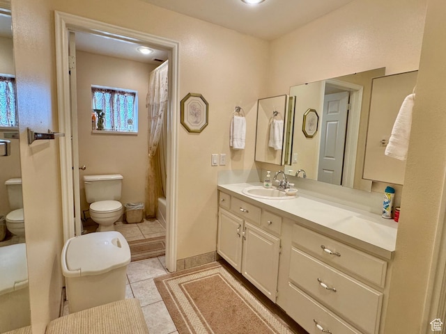 786 E Bristlecone Dr, Delta, UT 84624 - full bath featuring toilet, vanity, tile patterned flooring, and shower / bath combo with shower curtain