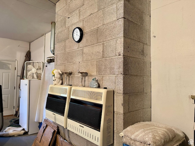 786 E Bristlecone Dr, Delta, UT 84624 - detailed view of heating unit, concrete block wall, and freestanding refrigerator