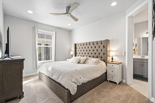 9857 N Featherstone Dr, Highland, UT 84003 - bedroom featuring light carpet, recessed lighting, ensuite bath, baseboards, and a ceiling fan