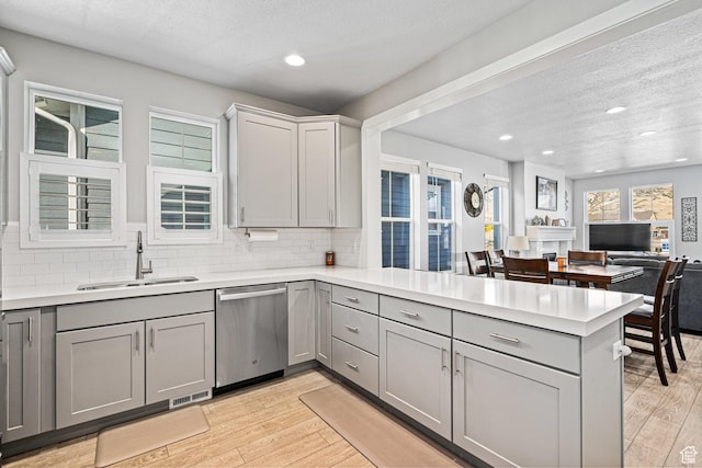 9857 N Featherstone Dr, Highland, UT 84003 - kitchen with dishwasher, a sink, gray cabinetry, a peninsula, and recessed lighting