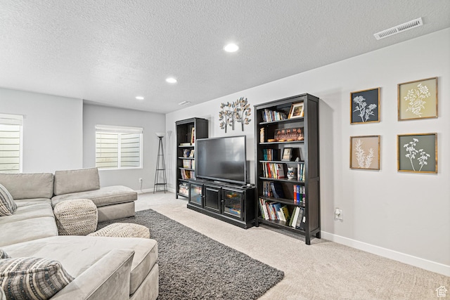 9857 N Featherstone Dr, Highland, UT 84003 - living area featuring a textured ceiling, baseboards, light carpet, and recessed lighting