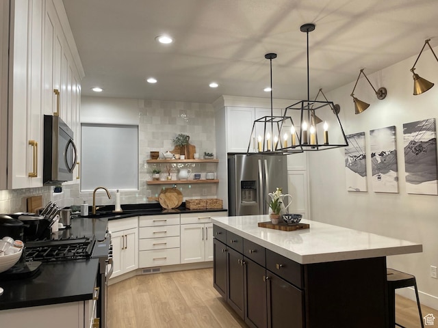 858 N Pinehurst Dr, Midway, UT 84049 - kitchen featuring stainless steel appliances, a sink, decorative backsplash, white cabinetry, and open shelves