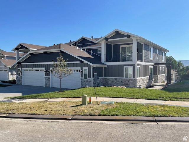 858 N Pinehurst Dr, Midway, UT 84049 - view of front of property featuring board and batten siding, stone siding, a balcony, a front lawn, and an attached garage