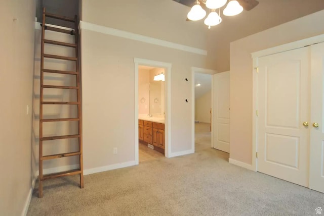 1035 N 130 W Unit 100, Logan, UT 84341 - unfurnished bedroom featuring light colored carpet, baseboards, and connected bathroom