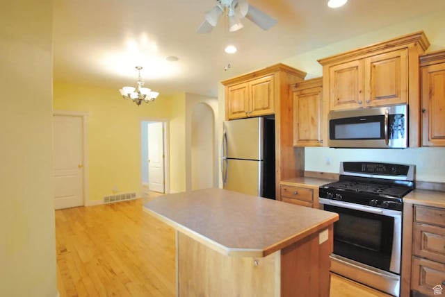 1035 N 130 W Unit 100, Logan, UT 84341 - kitchen with appliances with stainless steel finishes, a chandelier, a center island, recessed lighting, and light wood-style floors