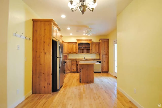 1035 N 130 W Unit 100, Logan, UT 84341 - kitchen featuring freestanding refrigerator, open shelves, a sink, light countertops, and a chandelier
