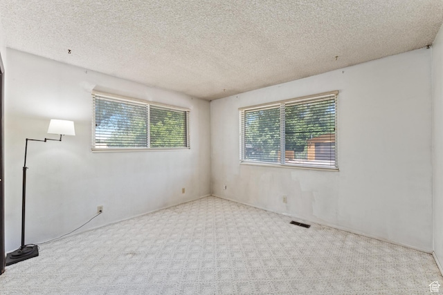 700 E Spruce Glen Rd, Murray, UT 84107 - carpeted empty room with a textured ceiling
