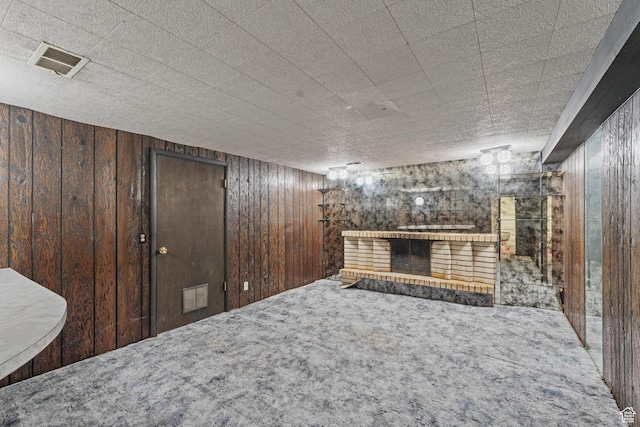 700 E Spruce Glen Rd, Murray, UT 84107 - unfurnished living room featuring a fireplace, wood walls, and carpet