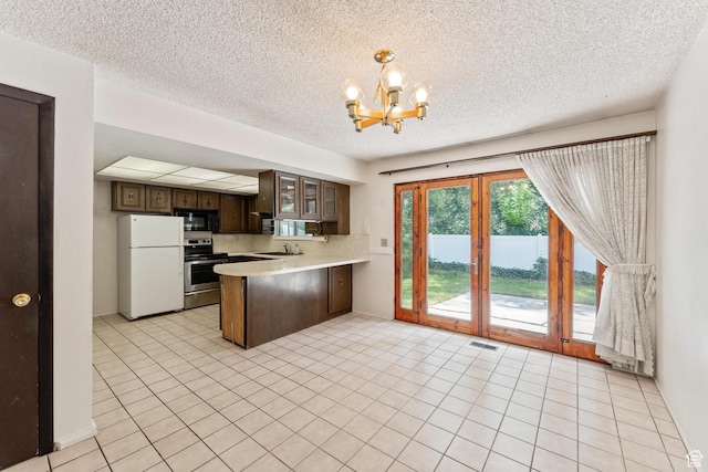 700 E Spruce Glen Rd, Murray, UT 84107 - kitchen featuring black microwave, freestanding refrigerator, stainless steel range with electric stovetop, a chandelier, and light countertops