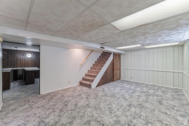 700 E Spruce Glen Rd, Murray, UT 84107 - finished basement featuring carpet flooring, stairway, baseboards, wood walls, and a drop ceiling
