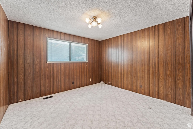 700 E Spruce Glen Rd, Murray, UT 84107 - carpeted spare room with a textured ceiling and wooden walls
