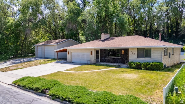 700 E Spruce Glen Rd, Murray, UT 84107 - ranch-style home featuring concrete driveway, brick siding, a porch, a front yard, and a chimney