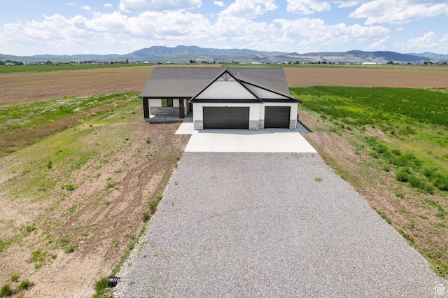 1120 S 800 W, Lewiston, UT 84320 - ranch-style house with driveway, an attached garage, a view of rural / pastoral area, and a mountain view