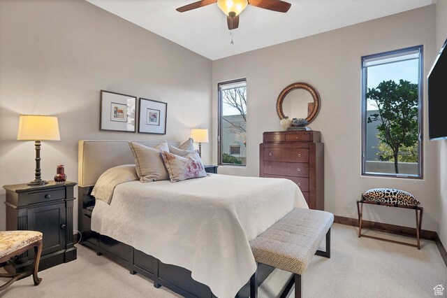 3052 N Snow Canyon Pwky Unit 168, St George, UT 84770 - bedroom with light colored carpet, multiple windows, and a ceiling fan