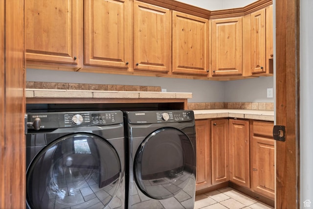 3052 N Snow Canyon Pwky Unit 168, St George, UT 84770 - laundry room featuring cabinet space, washing machine and dryer, and light tile patterned flooring