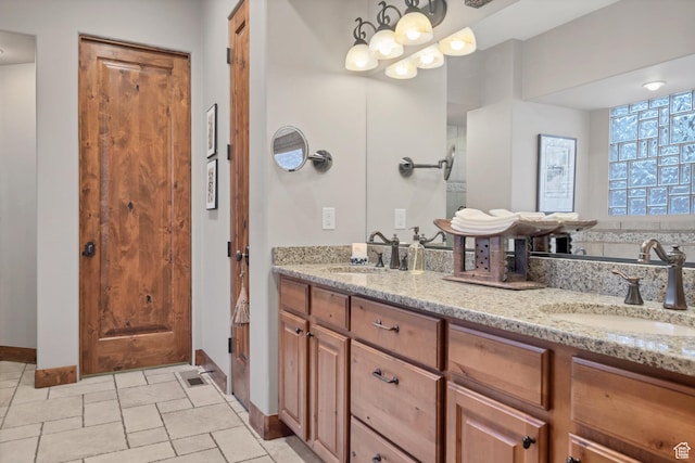 3052 N Snow Canyon Pwky Unit 168, St George, UT 84770 - bathroom featuring double vanity and baseboards