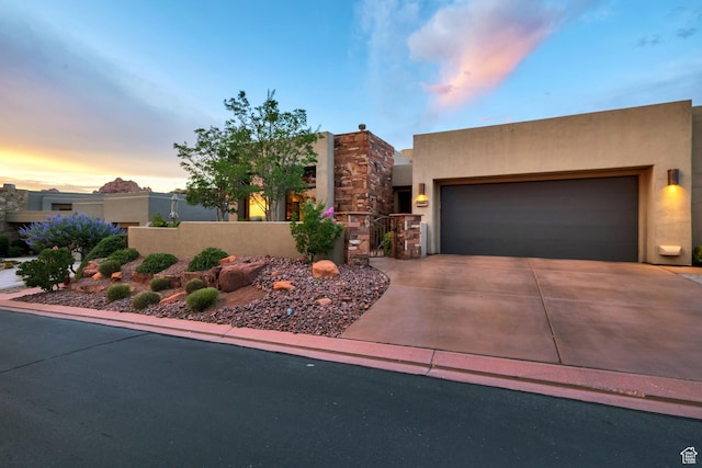 3052 N Snow Canyon Pwky Unit 168, St George, UT 84770 - adobe home featuring driveway, a garage, and stucco siding