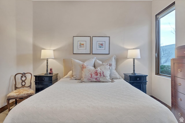 3052 N Snow Canyon Pwky Unit 168, St George, UT 84770 - bedroom with multiple windows and baseboards