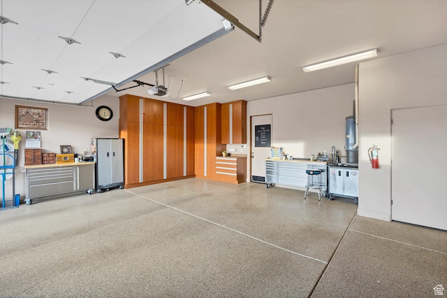 3052 N Snow Canyon Pwky Unit 168, St George, UT 84770 - garage with a garage door opener, a workshop area, and water heater