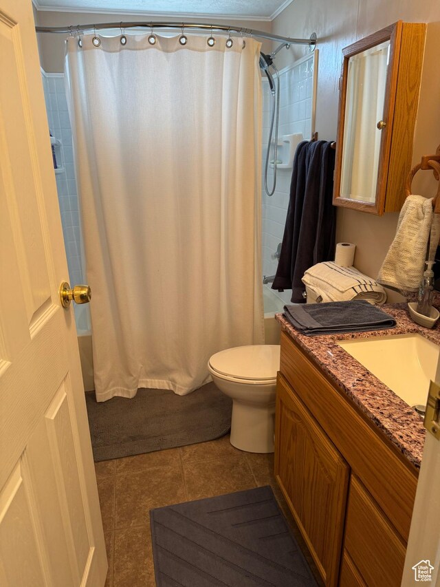 235 N 5th E, Manila, UT 84046 - full bath with shower / bathtub combination with curtain, vanity, tile patterned flooring, toilet, and ornamental molding