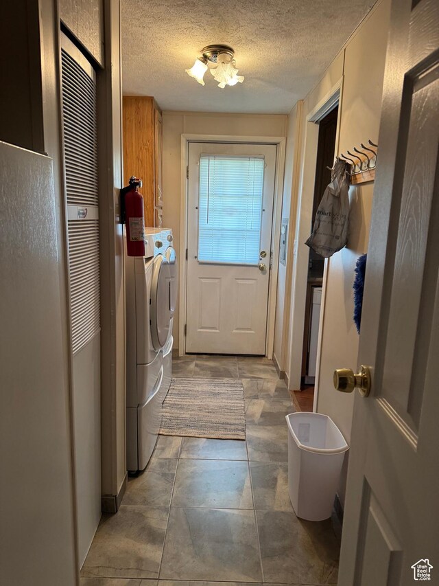 235 N 5th E, Manila, UT 84046 - washroom with cabinet space, washing machine and clothes dryer, and a textured ceiling