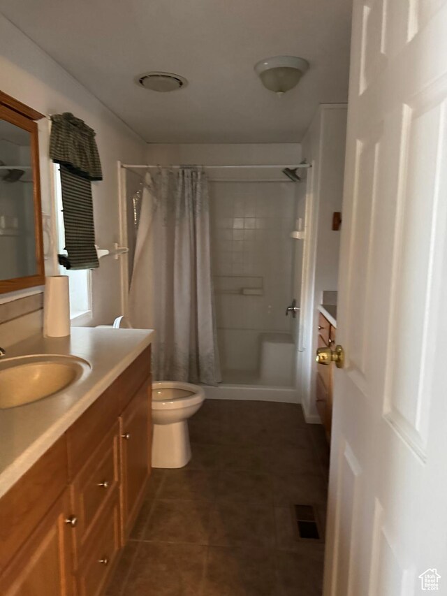 235 N 5th E, Manila, UT 84046 - full bathroom with vanity, a shower with curtain, tile patterned flooring, and toilet