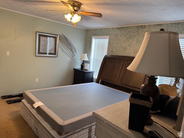235 N 5th E, Manila, UT 84046 - bedroom featuring crown molding, ceiling fan, wallpapered walls, and carpet