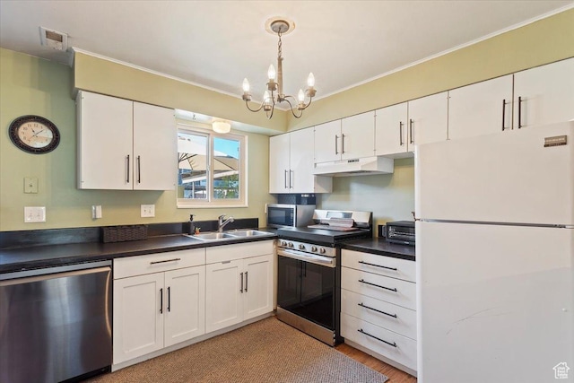 88 W 50 S Unit H7, Centerville, UT 84014 - kitchen with appliances with stainless steel finishes, a sink, under cabinet range hood, white cabinetry, and dark countertops