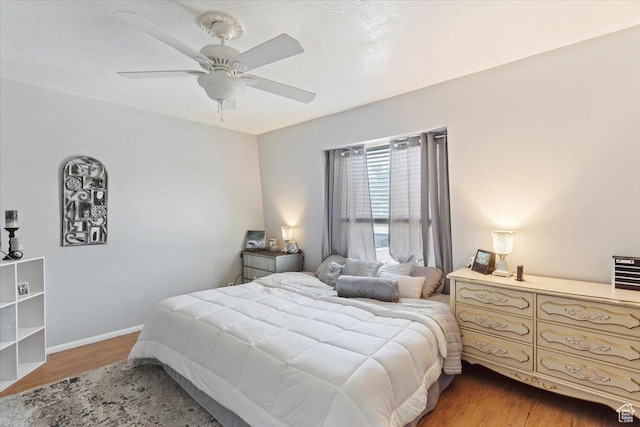 88 W 50 S Unit H7, Centerville, UT 84014 - bedroom with light wood-type flooring, a ceiling fan, and baseboards