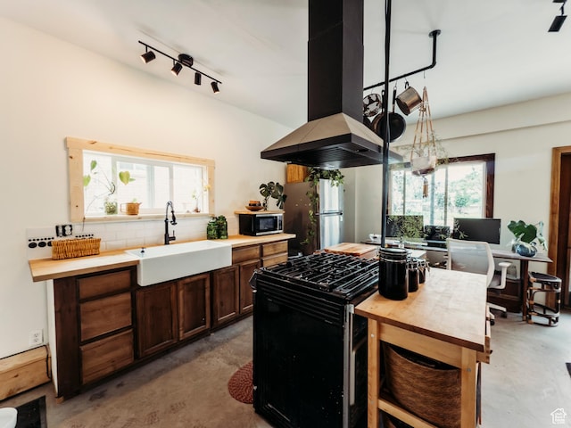 1 S 3rd Ave, Helper, UT 84526 - kitchen with a sink, appliances with stainless steel finishes, finished concrete floors, and plenty of natural light