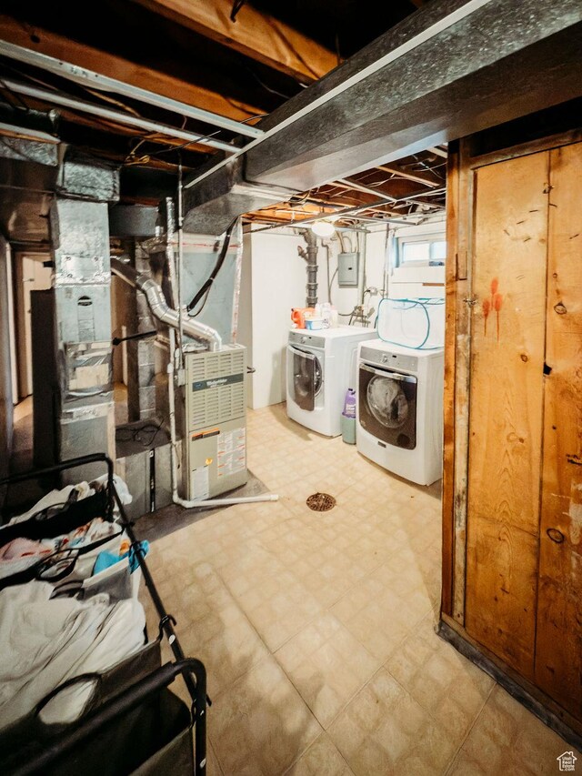 1 S 3rd Ave, Helper, UT 84526 - basement featuring washer and clothes dryer, tile patterned floors, and heating unit