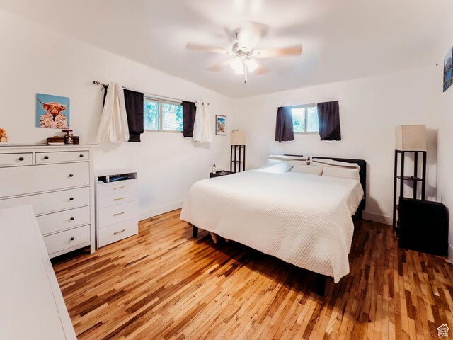 1 S 3rd Ave, Helper, UT 84526 - bedroom featuring light wood-style floors, ceiling fan, and baseboards