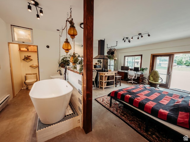 1 S 3rd Ave, Helper, UT 84526 - bedroom featuring track lighting, concrete flooring, access to exterior, and a baseboard heating unit